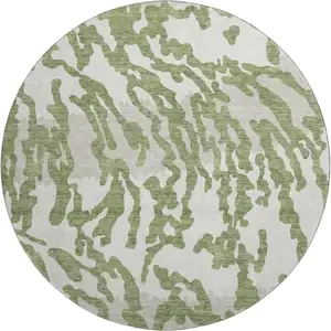 Photo of 8' Green And Ivory Animal Print Washable Round Rug With UV Protection