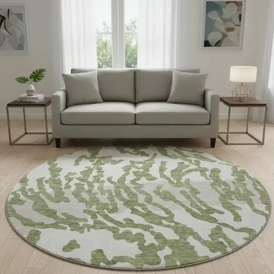 8' Green And Ivory Animal Print Washable Round Rug With UV Protection Photo 2