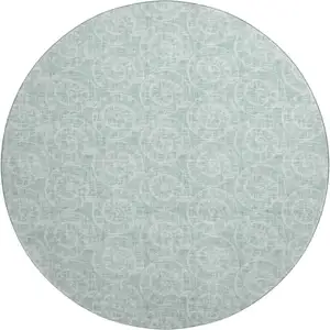 Photo of 8' Green And Ivory Geometric Washable Round Rug With UV Protection