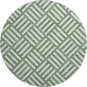 Photo of 8' Green And Ivory Geometric Washable Round Rug With UV Protection