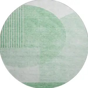Photo of 8' Green And Ivory Geometric Washable Round Rug With UV Protection