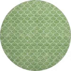 Photo of 8' Green And Ivory Geometric Washable Round Rug With UV Protection