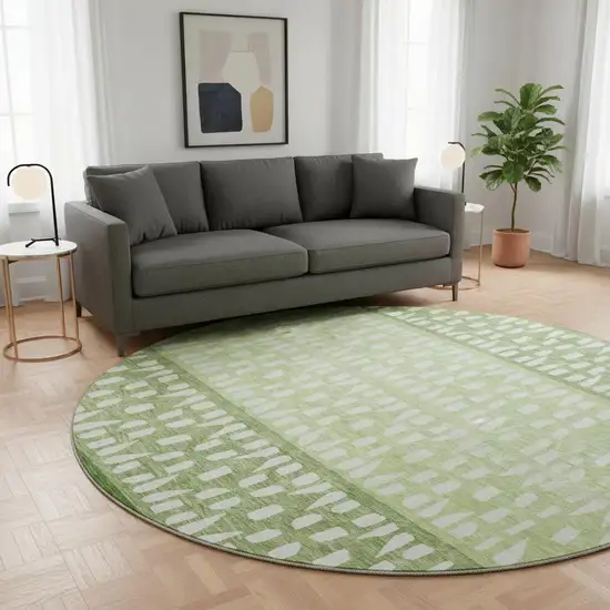 8' Green And Ivory Geometric Washable Round Rug With UV Protection Photo 2