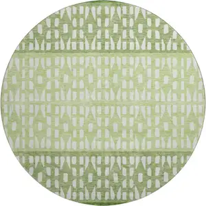 Photo of 8' Green And Ivory Geometric Washable Round Rug With UV Protection