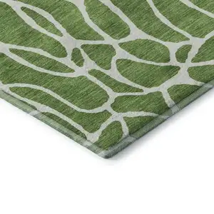 Photo of 8' Green And Ivory Geometric Washable Round Rug With UV Protection