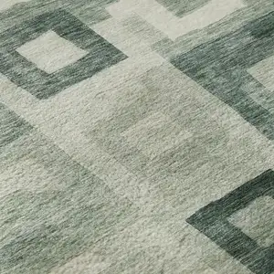 Photo of 8' Green And Ivory Geometric Washable Round Rug With UV Protection