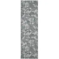 Photo of 10' Green And Ivory Patchwork Distressed Stain Resistant Runner Rug