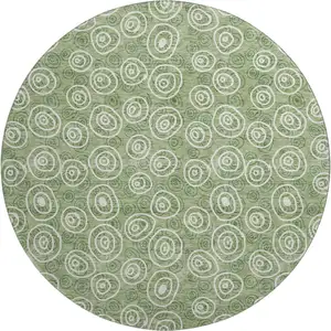 Photo of 8' Green And Ivory Polka Dot Washable Round Rug With UV Protection