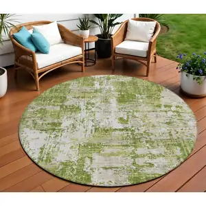 Photo of 8' Green And Ivory Round Abstract Washable Indoor Outdoor Area Rug