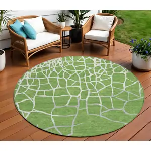 Photo of 8' Green And Ivory Round Abstract Washable Indoor Outdoor Area Rug