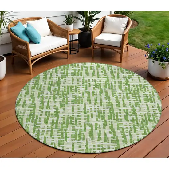 8' Green And Ivory Round Abstract Washable Indoor Outdoor Area Rug Photo 1