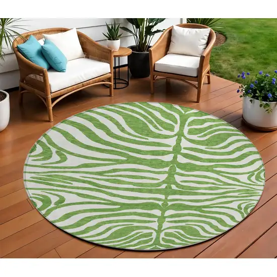 8' Green And Ivory Round Animal Print Washable Indoor Outdoor Area Rug Photo 1