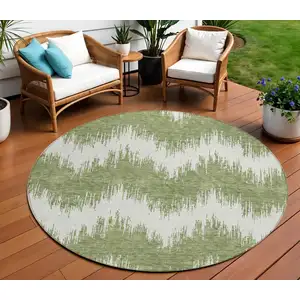 Photo of 8' Green And Ivory Round Chevron Washable Indoor Outdoor Area Rug