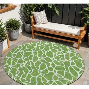 Photo of 8' Green And Ivory Round Geometric Washable Indoor Outdoor Area Rug