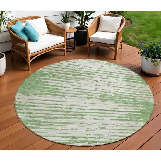 8' Green And Ivory Round Striped Washable Indoor Outdoor Area Rug Photo 1
