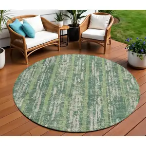 Photo of 8' Green And Ivory Round Striped Washable Indoor Outdoor Area Rug
