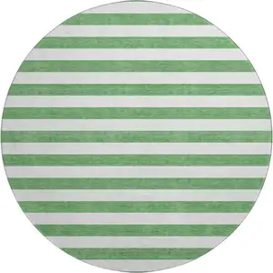 Photo of 8' Green And Ivory Striped Washable Round Rug With UV Protection