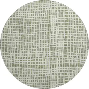 Photo of 8' Green And Ivory Striped Washable Round Rug With UV Protection