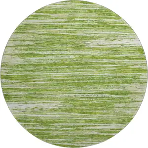 Photo of 8' Green And Ivory Striped Washable Round Rug With UV Protection