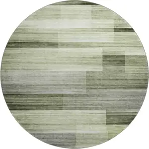 Photo of 8' Green And Ivory Striped Washable Round Rug With UV Protection