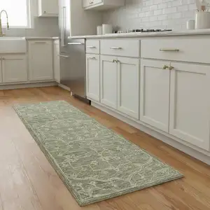 Photo of 8' Green And Ivory Wool Floral Hand Tufted Runner Rug