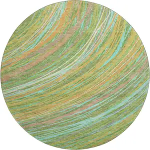 Photo of 8' Green And Peach Abstract Washable Round Rug With UV Protection