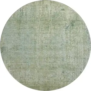 Photo of 8' Green And Sage Abstract Washable Round Rug With UV Protection