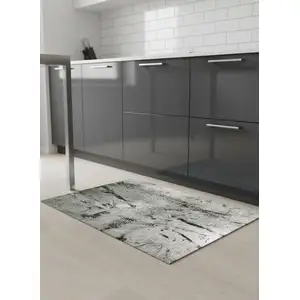 Photo of 5' Green And White Abstract Washable Round Rug With UV Protection