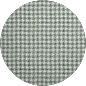 Photo of 8' Green And White Houndstooth Washable Round Rug With UV Protection