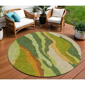 Photo of 8' Green Beige And Copper Round Abstract Washable Indoor Outdoor Area Rug