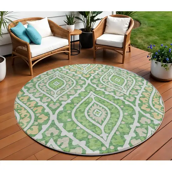 8' Green Beige And Ivory Round Floral Washable Indoor Outdoor Area Rug Photo 1