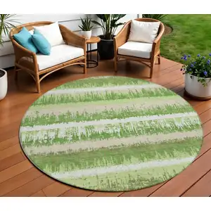 Photo of 8' Green Beige And Ivory Round Striped Washable Indoor Outdoor Area Rug