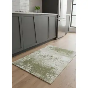 Photo of 5' Green Beige And White Abstract Washable Round Rug With UV Protection