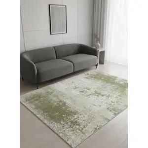 Photo of 8' Green Beige And White Abstract Washable Round Rug With UV Protection