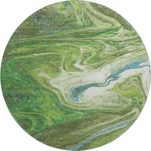 Photo of 8' Green Blue And Ivory Abstract Washable Round Rug With UV Protection