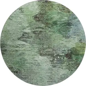 Photo of 8' Green Brown And Ivory Abstract Washable Round Rug With UV Protection