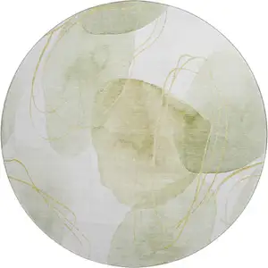 Photo of 8' Green Gold And Ivory Abstract Washable Round Rug With UV Protection