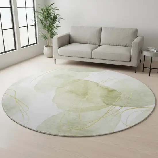 8' Green Gold And Ivory Abstract Washable Round Rug With UV Protection Photo 2