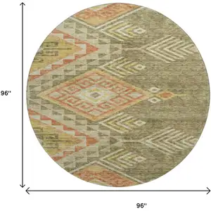 Photo of 8' Green Gold And Salmon Geometric Washable Round Rug With UV Protection