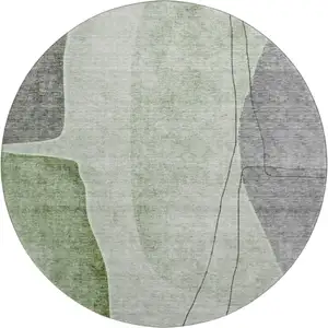 Photo of 8' Green Gray And Ivory Abstract Washable Round Rug With UV Protection