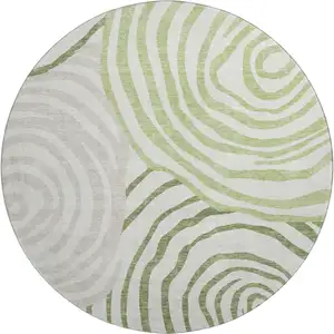 Photo of 8' Green Gray And Ivory Abstract Washable Round Rug With UV Protection