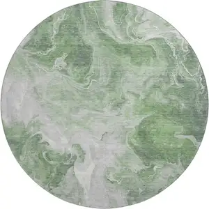 Photo of 8' Green Gray And Ivory Abstract Washable Round Rug With UV Protection