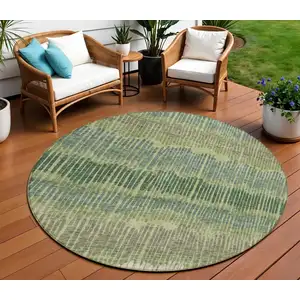 Photo of 8' Green Gray And Ivory Round Striped Washable Indoor Outdoor Area Rug