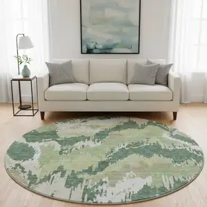 Photo of 8' Green Ivory And Beige Abstract Washable Round Rug With UV Protection