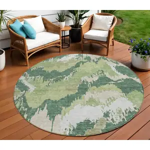 Photo of 8' Green Ivory And Beige Round Abstract Washable Indoor Outdoor Area Rug