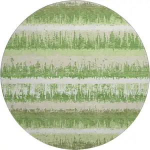 Photo of 8' Green Ivory And Beige Striped Washable Round Rug With UV Protection