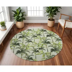 Photo of 8' Green Ivory And Charcoal Geometric Washable Round Rug With UV Protection