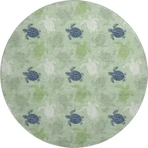 Photo of 8' Green Ivory And Navy Blue Geometric Washable Round Rug With UV Protection