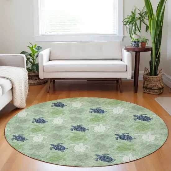 8' Green Ivory And Navy Blue Geometric Washable Round Rug With UV Protection Photo 5