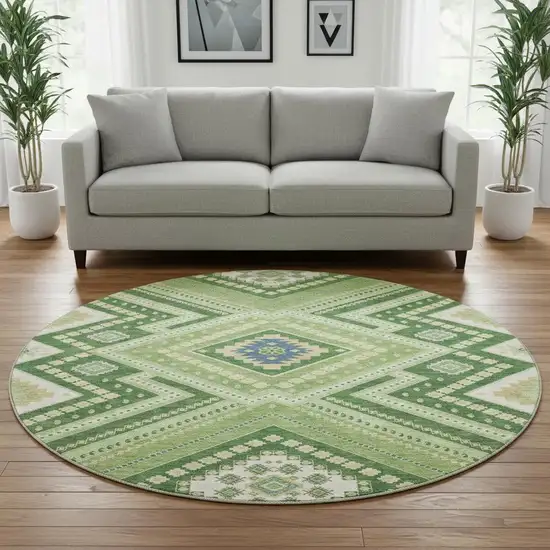 8' Green Navy Blue And Ivory Tribal Washable Round Rug With UV Protection Photo 2